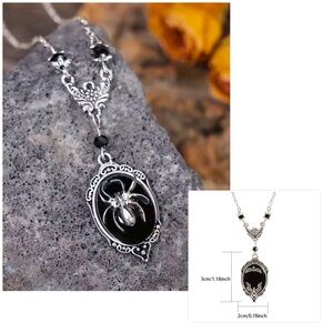 BLACK AND SILVER WITCHS BAT NECKLACE